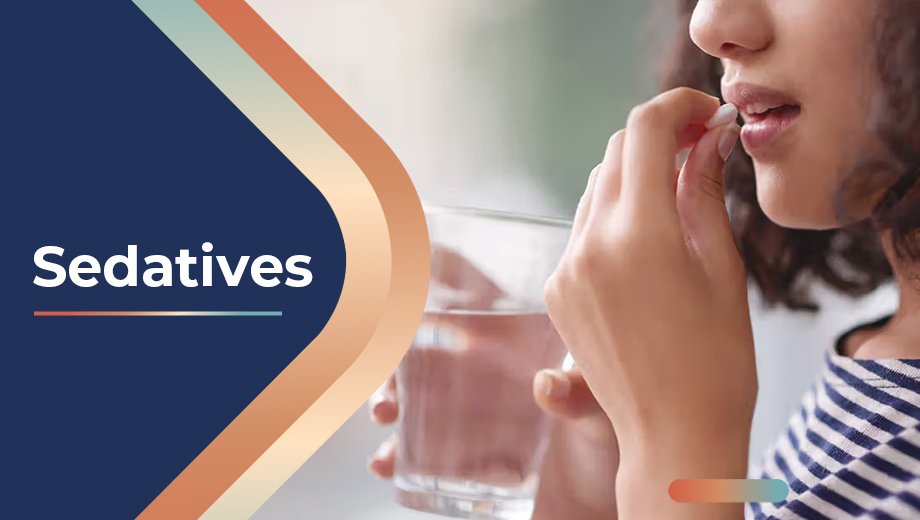 Sedatives 1 Woman taking a sedative pill with a glass of water – Sedatives Guide