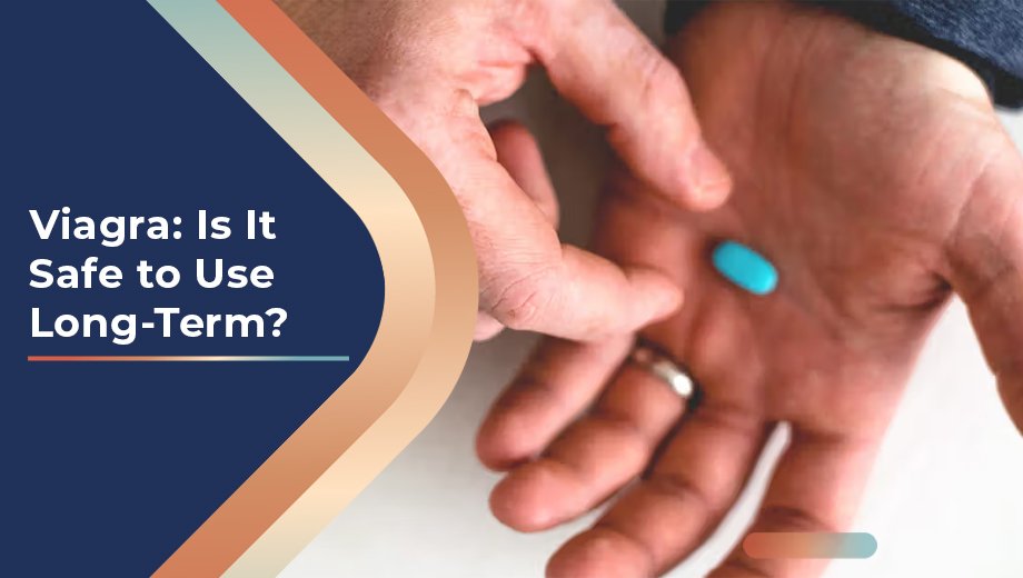 Viagra: Is It Safe to Use Long-Term? 1 Hand holding a blue Viagra pill